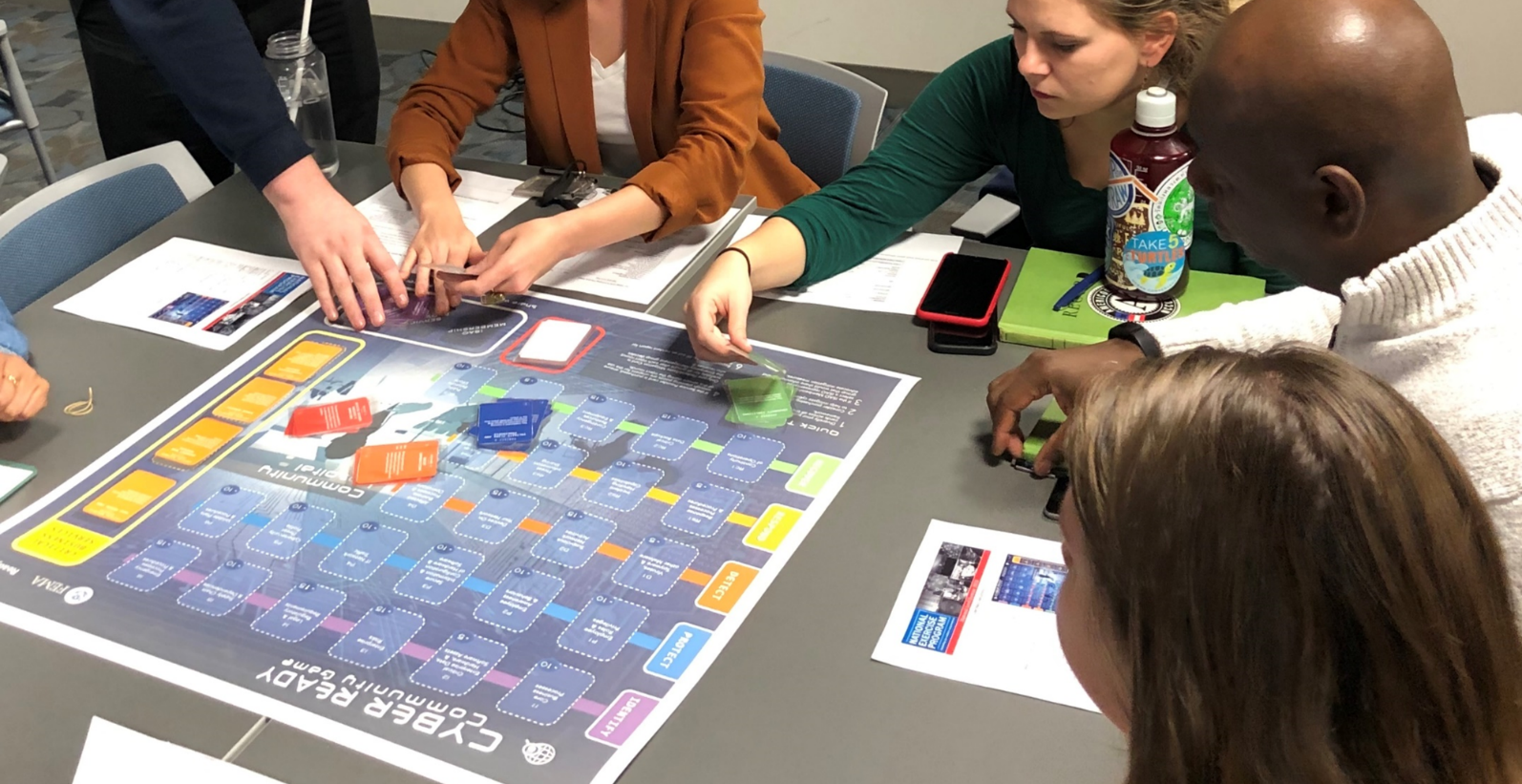 People playing the Cyber Ready Community board game